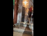 Man red checkered shirt stand on poles