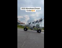 Men ride huge shopping cart on road