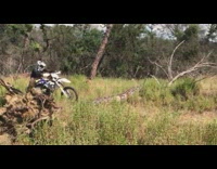 Guy falls off bike over tree slow motion 