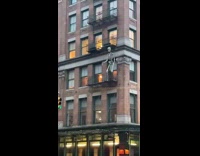Tall skeleton decoration outside on apartment balcony 