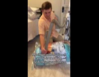 Man vacuums plastic with stuffed toys inside