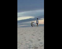 Woman dances on sand dune video