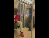 Guy dances near subway doors and sings