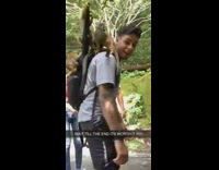 Guy four brown monkeys on back phone 