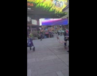 Black shirt girl dances times square starbucks