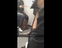 man bites into whole avocado on train