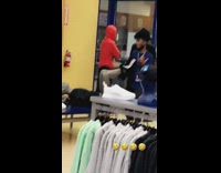 Store employee puts pants on mannequin 