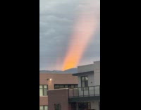 Ray of red sunset light shine upwards