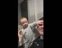Baby poses for picture and then slaps guy 