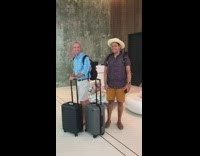 Tourists dance in hotel lobby 