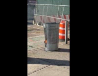 Garbage burn and melt trash can street