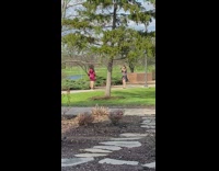 Woman in red satin dress run towards her friend