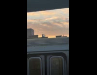 Woman hula hoop exercise near train station