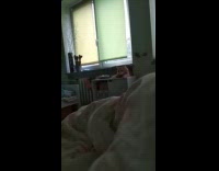 Cat climb up from behind the cabinet