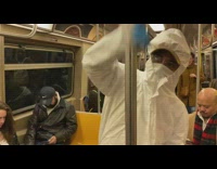 white hazmat suit girl cleans pole windex
