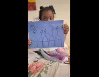 Woman shows her daughter drawing 