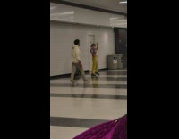 Girl with red hula hoop around arm 