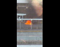 Black car burn outside of airport