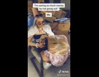 Black dress girl surrounded by boxes 