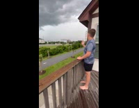 Teen pointing on right timing with lightning strike 
