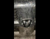 Ice forms the logo of the car at the parking lot