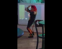 Woman with devil horns selfie video in front of the stage at the bar