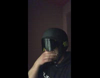 Guy black helmet ski goggles raw egg