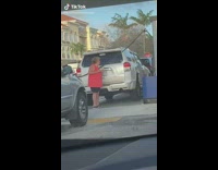 Woman reacts to pumping gas 