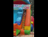 Girl slips slides down stairs water slide