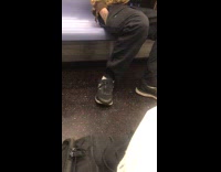Guy in green brown jacket asks stranger if drugs is better than food on the subway