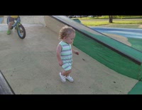 Two kid raced down the slope at the bike park