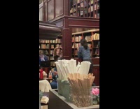 Girls library photo shoot book bookshelves 