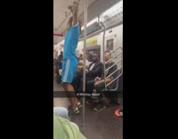 Guy in blue Adidas soccer uniform dances and contorts body on subway