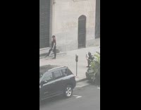 Girl red bandana protest sign black SUV