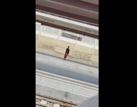 man in red records person training