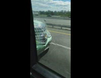 White paint baby doll tied to truck