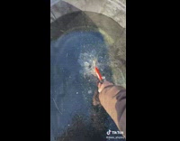 Breaking and carrying frozen ice sheet with hammer 