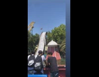 Man Gets Splashed as Ride Descends from Water Slide