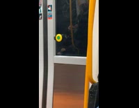 Guy on subway sings into microphone mask 