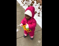 Filmer throws snowball at the little girl