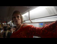 Queer marching band performs during train ride