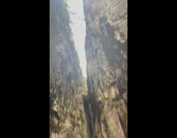 Guy holding pipe shows off nature surroundings 