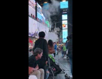 Woman filming music video at times square 