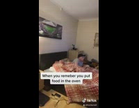 Guy puts food in oven plays game 