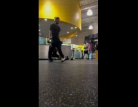 Man exercise sits on kettlebell at gym