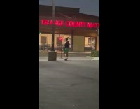 Man Tank top flex muscle Orange County Mattress Store Parking Lot
