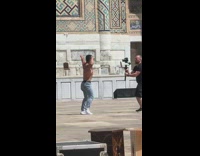 Man shirtless flex muscle video shoot mosque