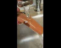 Collab BitchIG2 - Guy cuts twix chocolate bar and rinses chocolate off 