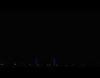 Lightning strike on the dark clouds caught through the window