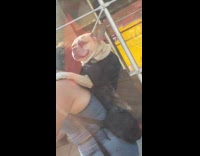 Cyclist woman carry pet dog on backpack